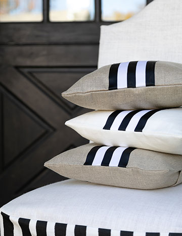 Striped pillows on chair in front of door