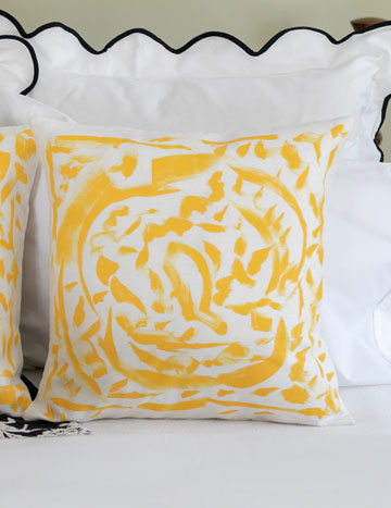 close-up of patterned yellow and white pillow